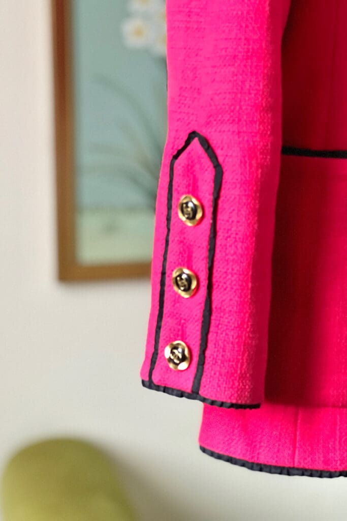 buttons on sleeves of pink Chanel jacket 